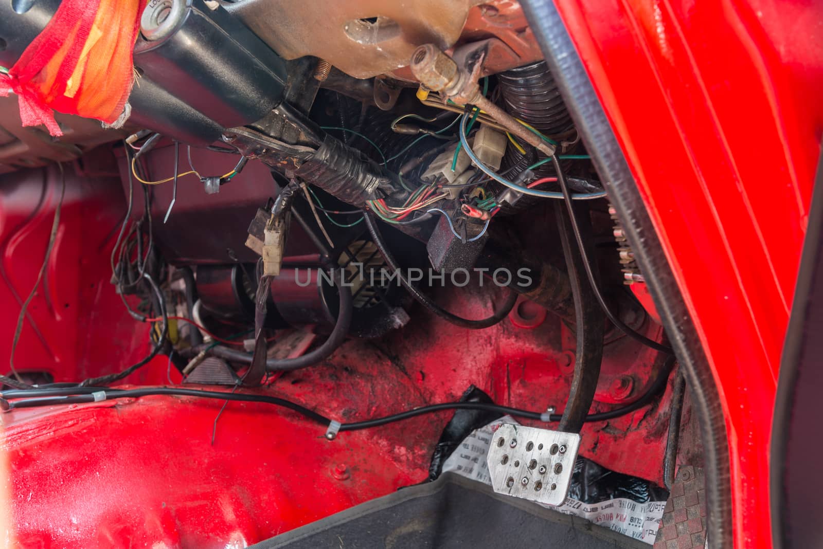 Repair of old car in the garage.