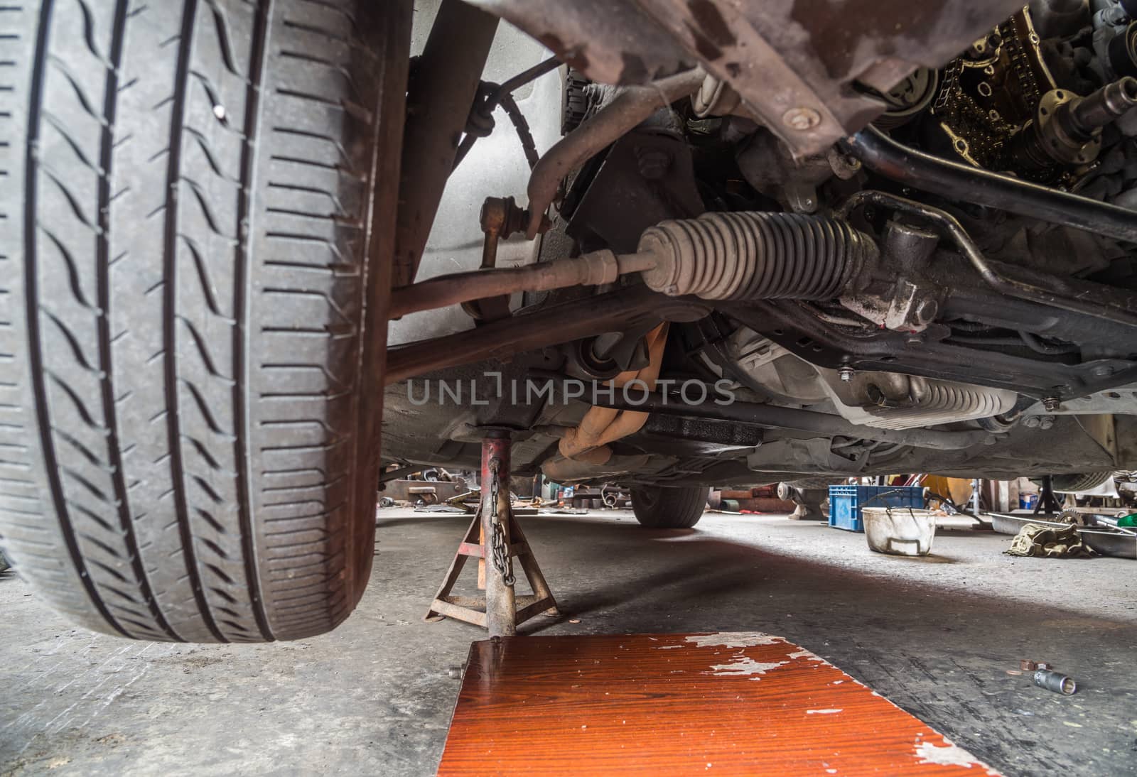 Repair of old car in the garage.