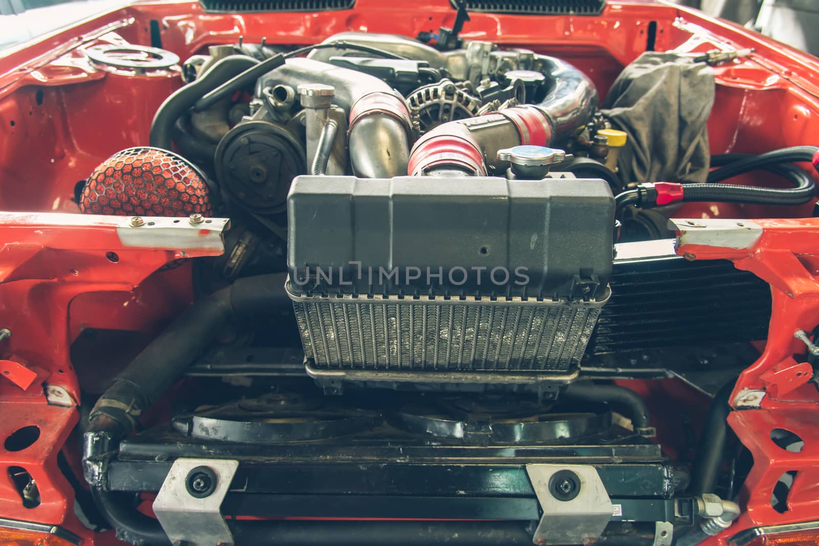 Repair of old car in the garage.