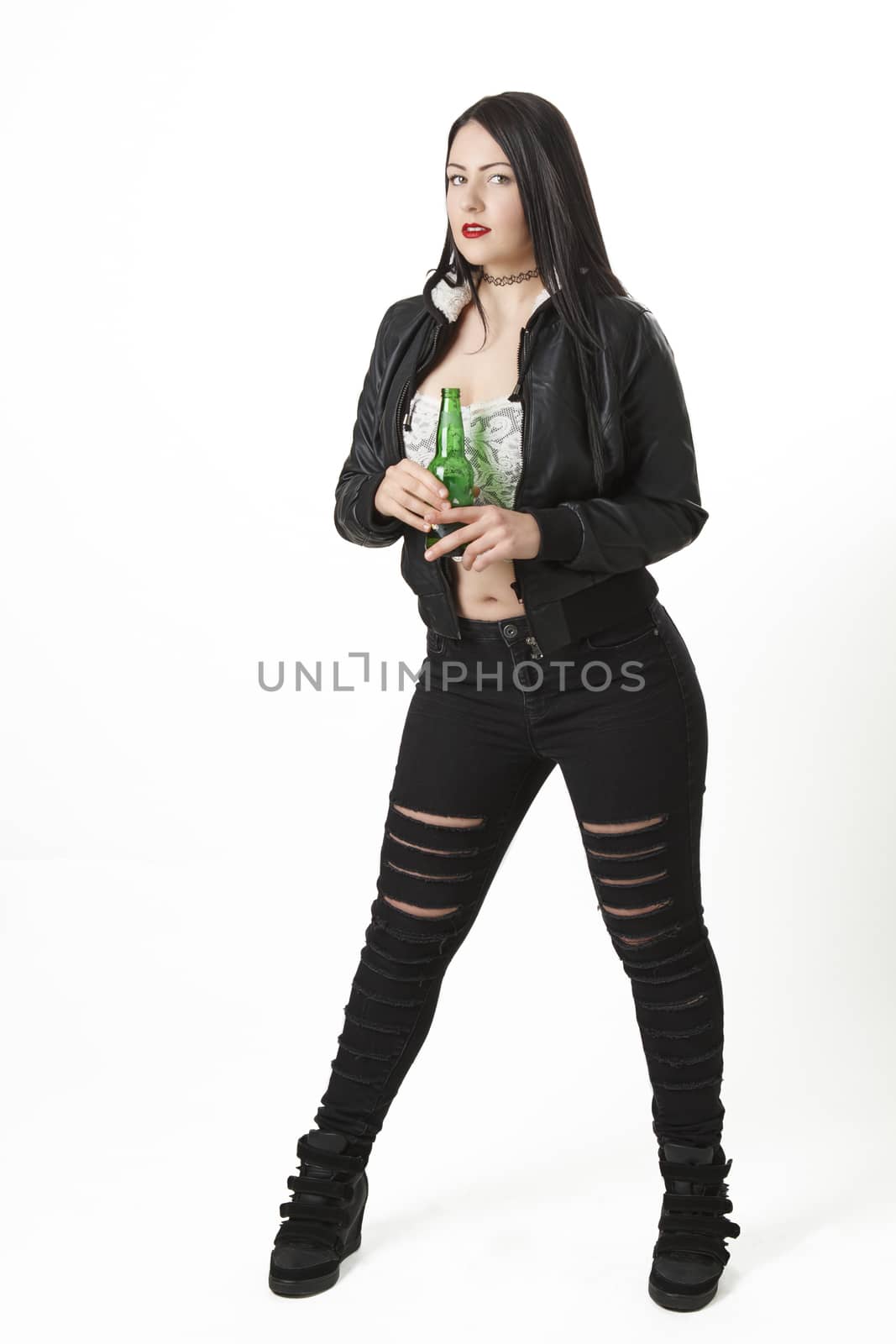 twenty something girl holding a green bottle of beer