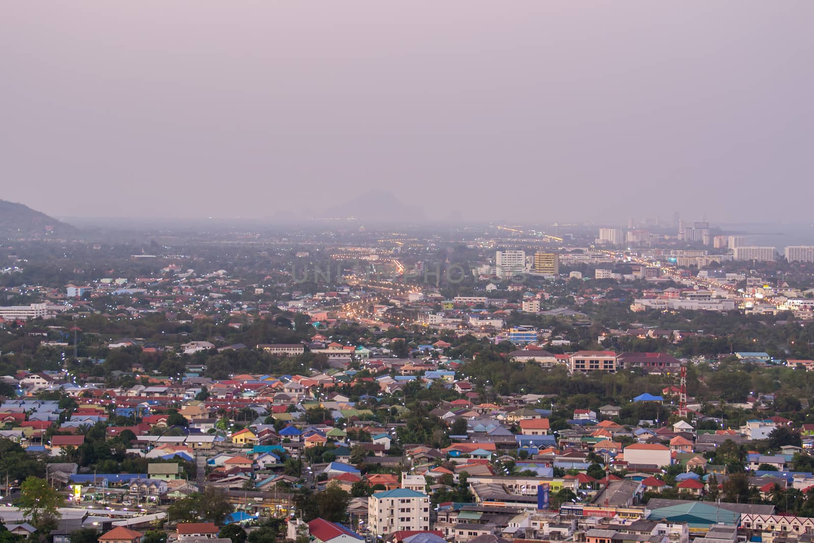 a view over the big asian city of Bangkok , Thailand at nighttime when the tall skyscrapers are illuminated.