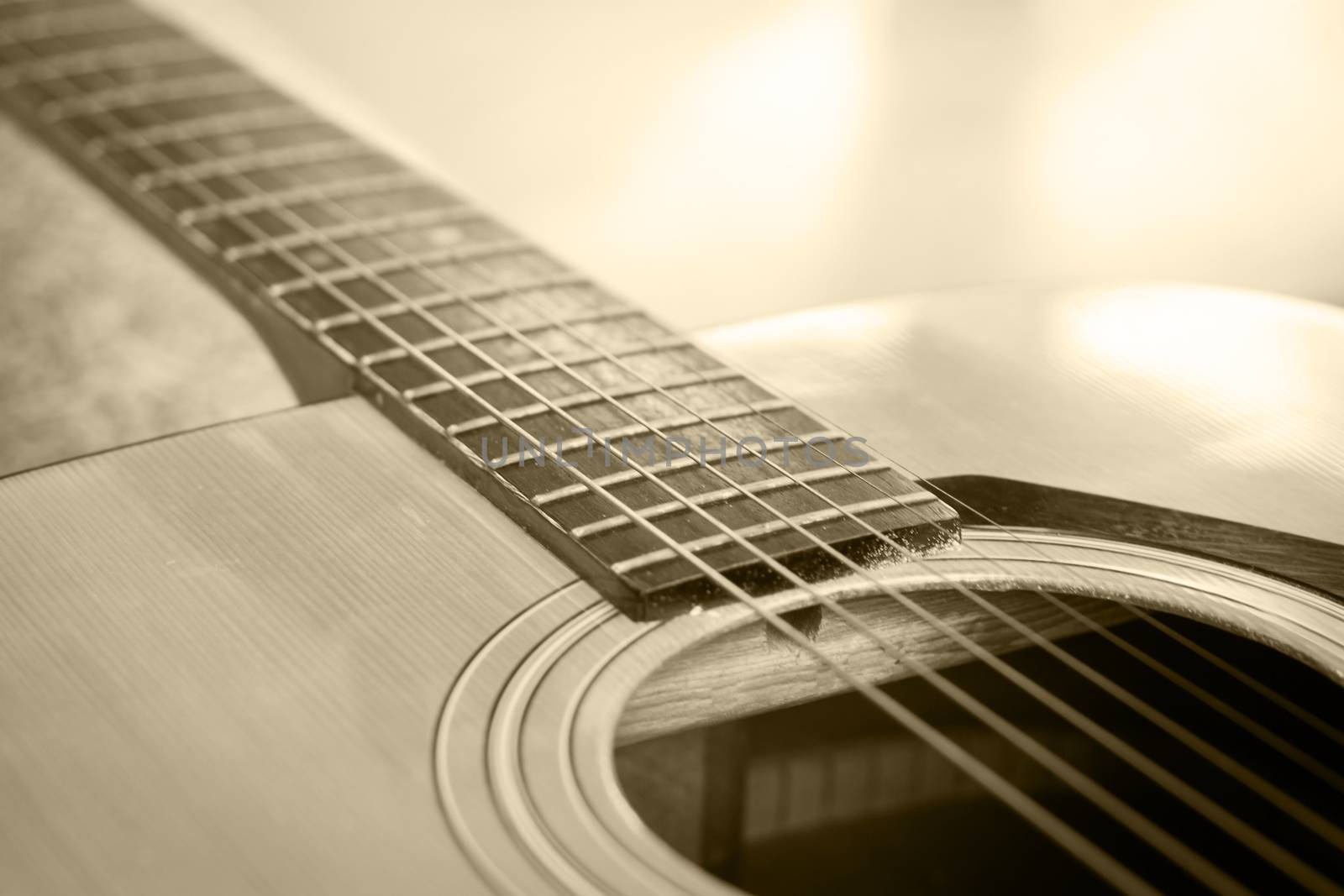 Close up acoustic guitar detail vintage filter by punsayaporn