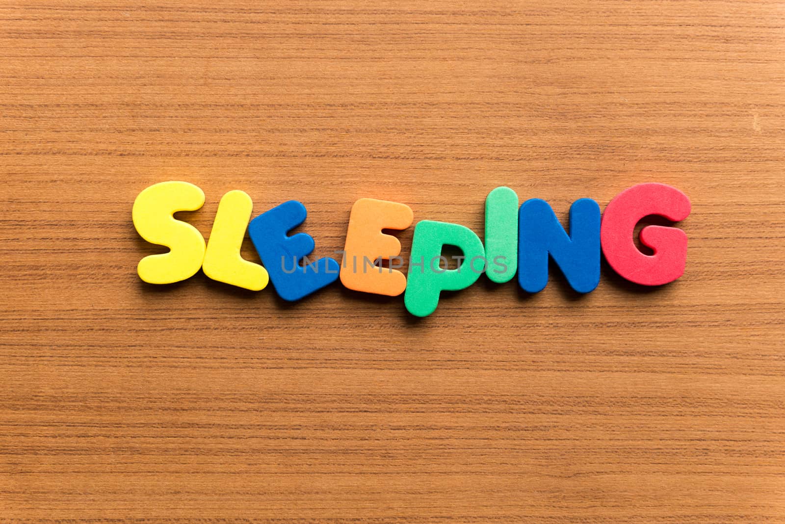 sleeping colorful word on the wooden background