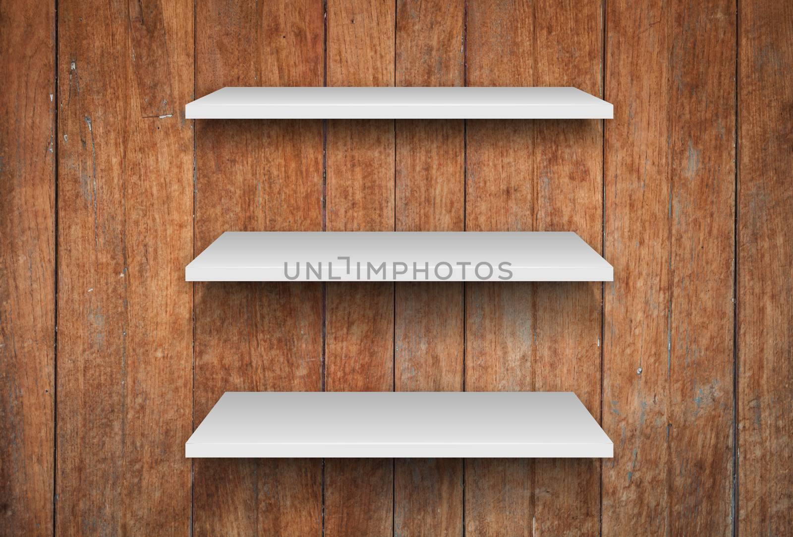 Three white shelves on wooden interior texture background by punsayaporn