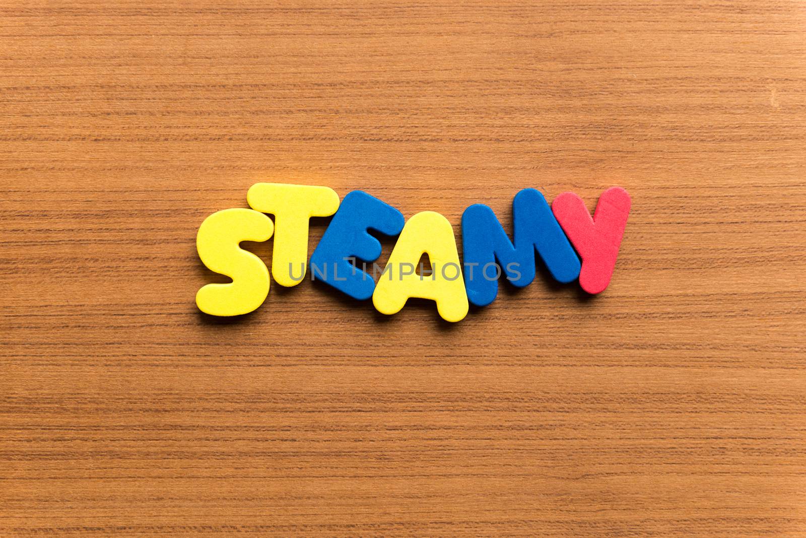 steamy colorful word on the wooden background
