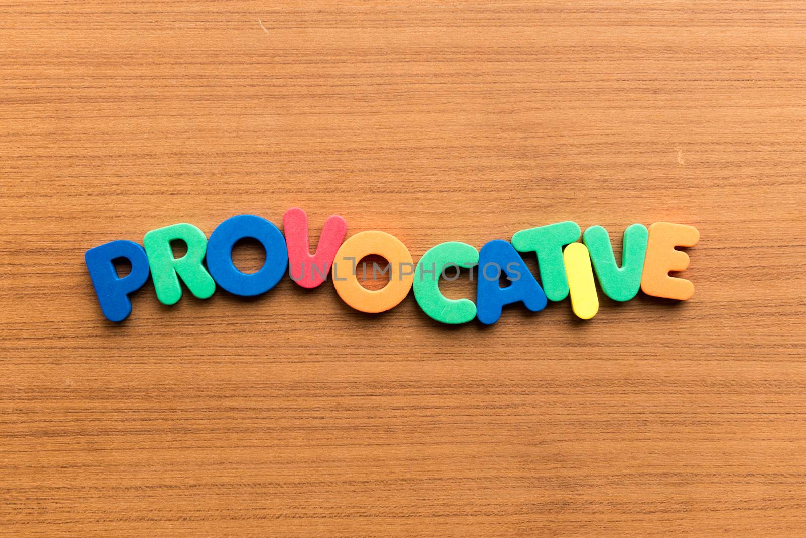 provocative colorful word on the wooden background