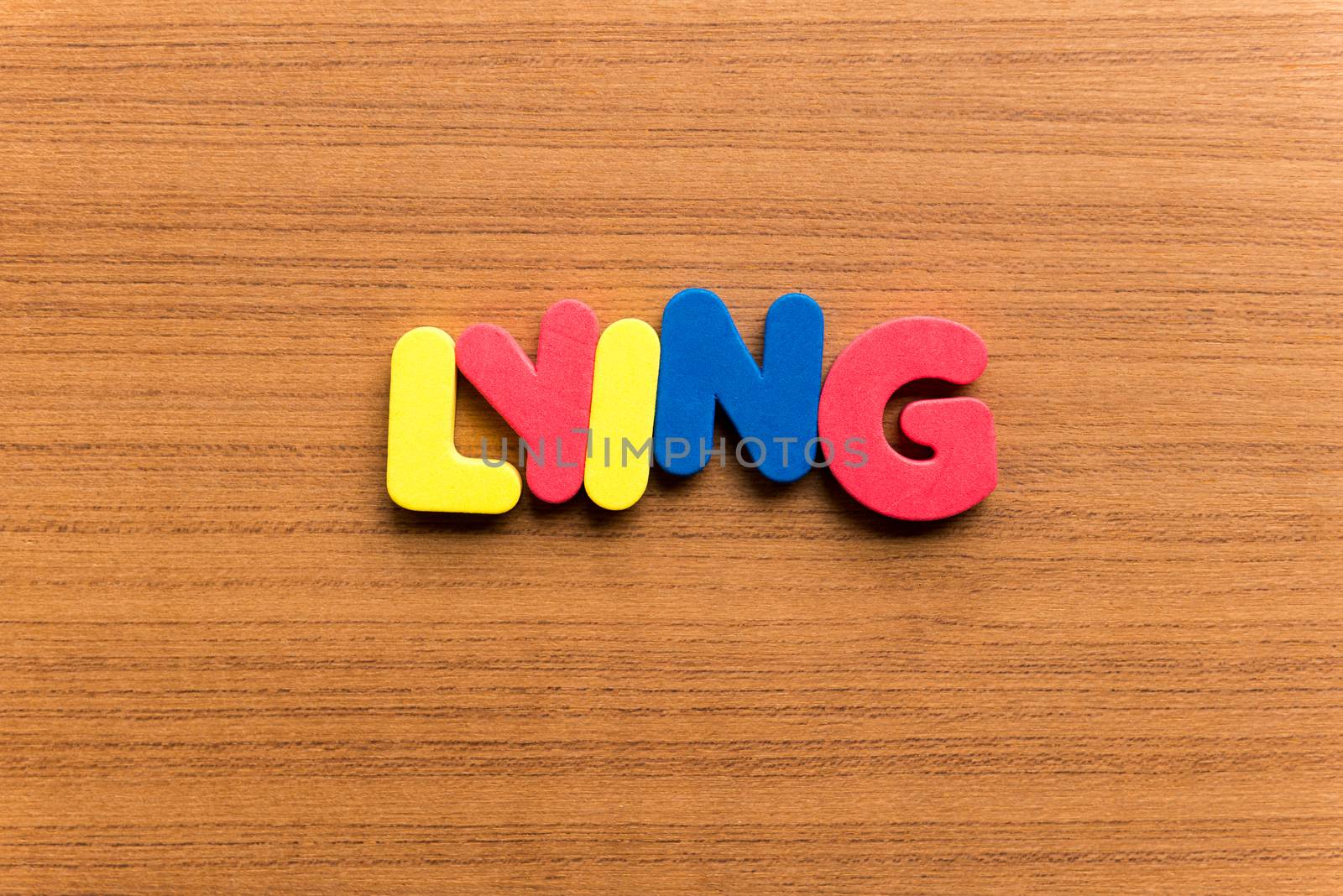 lying colorful word on the wooden background