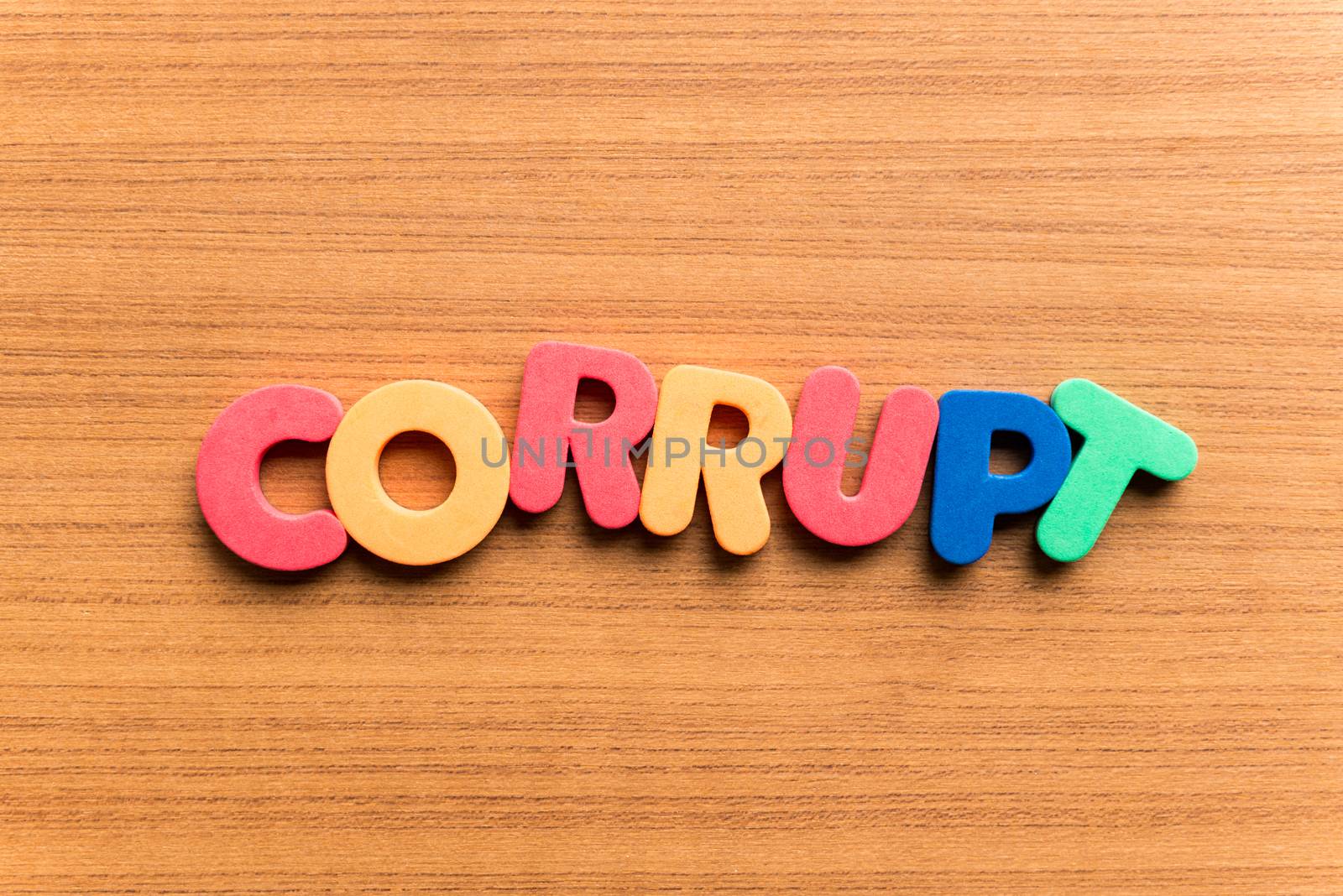 corrupt colorful word on the wooden background