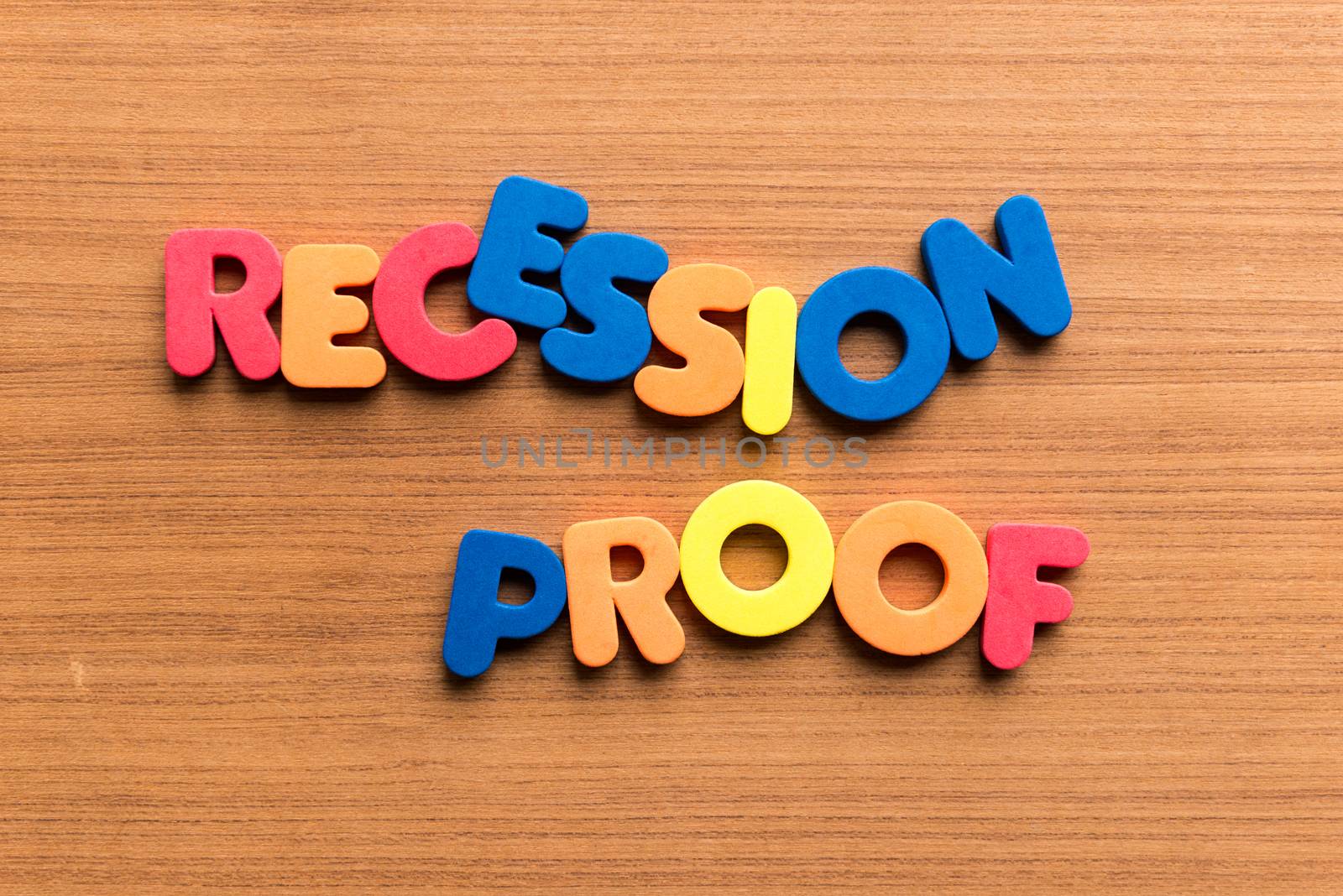 recession proof colorful word on the wooden background