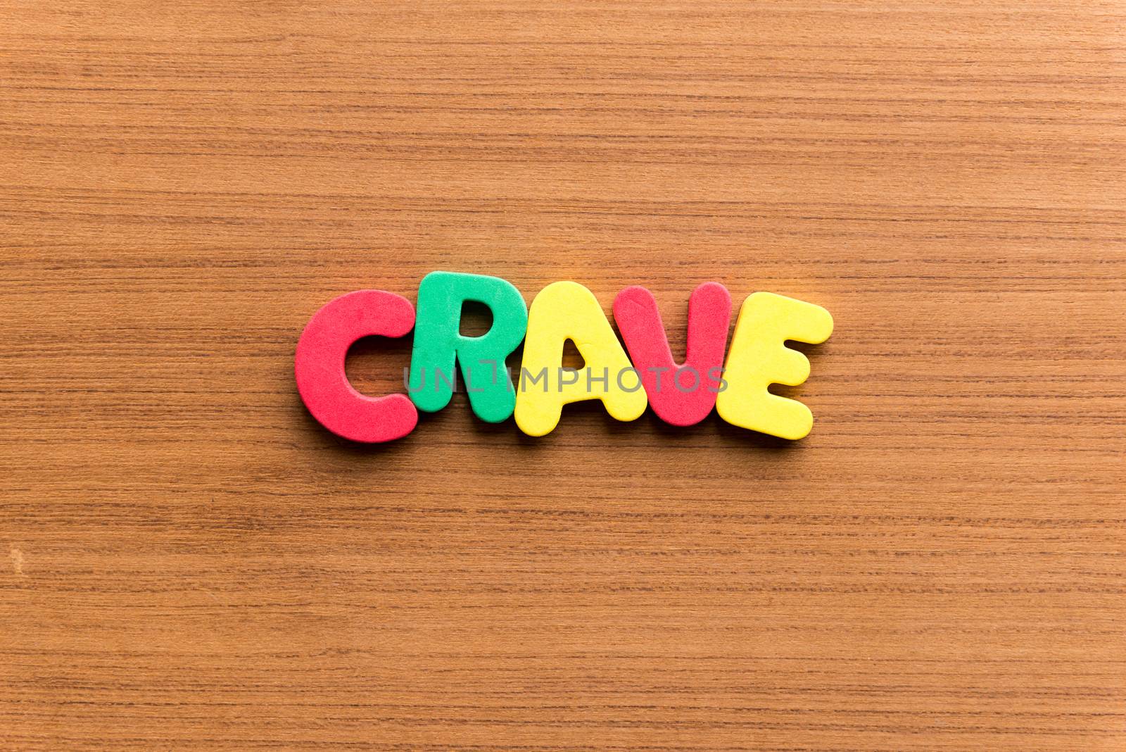 crave colorful word on the wooden background