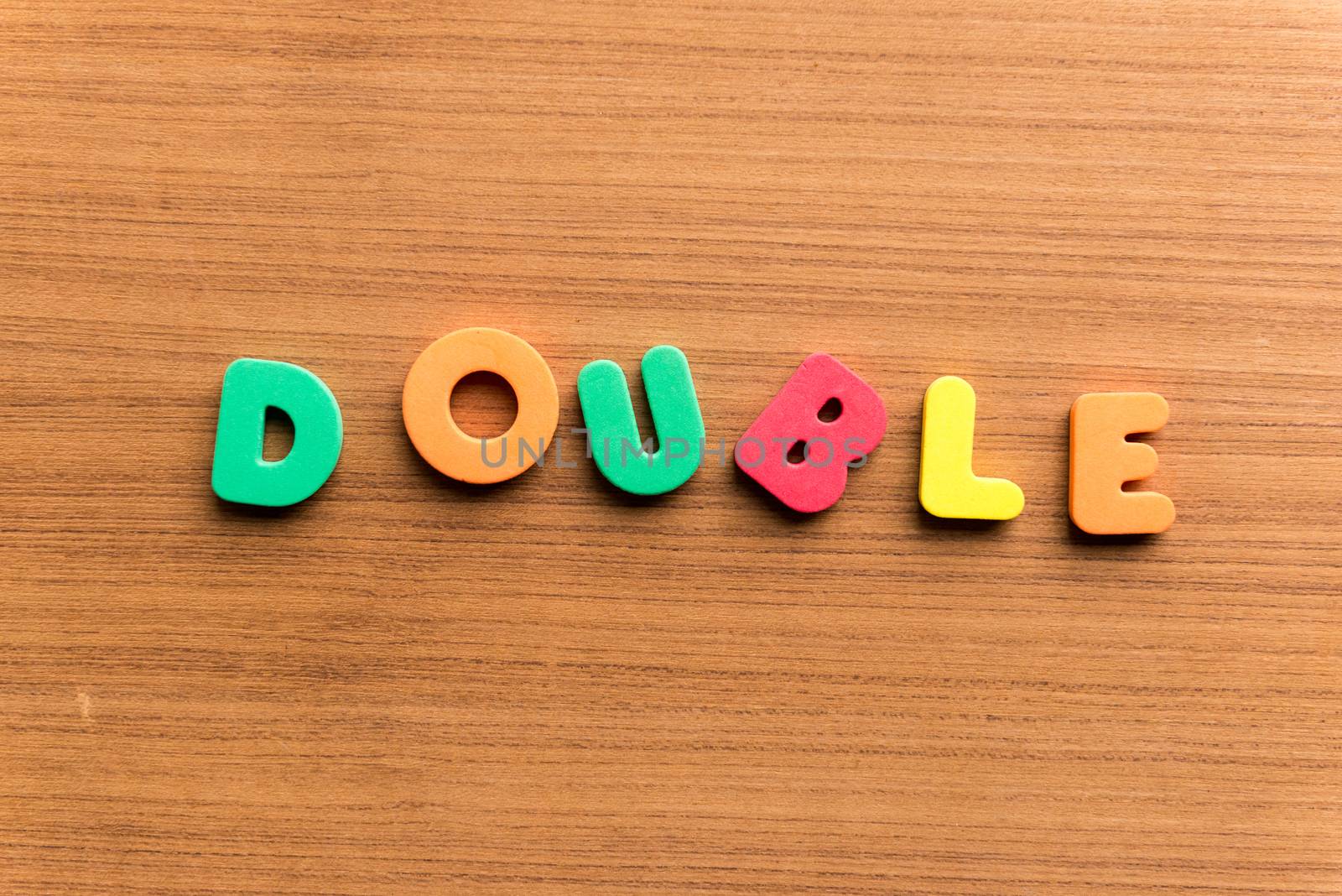 double colorful word on the wooden background