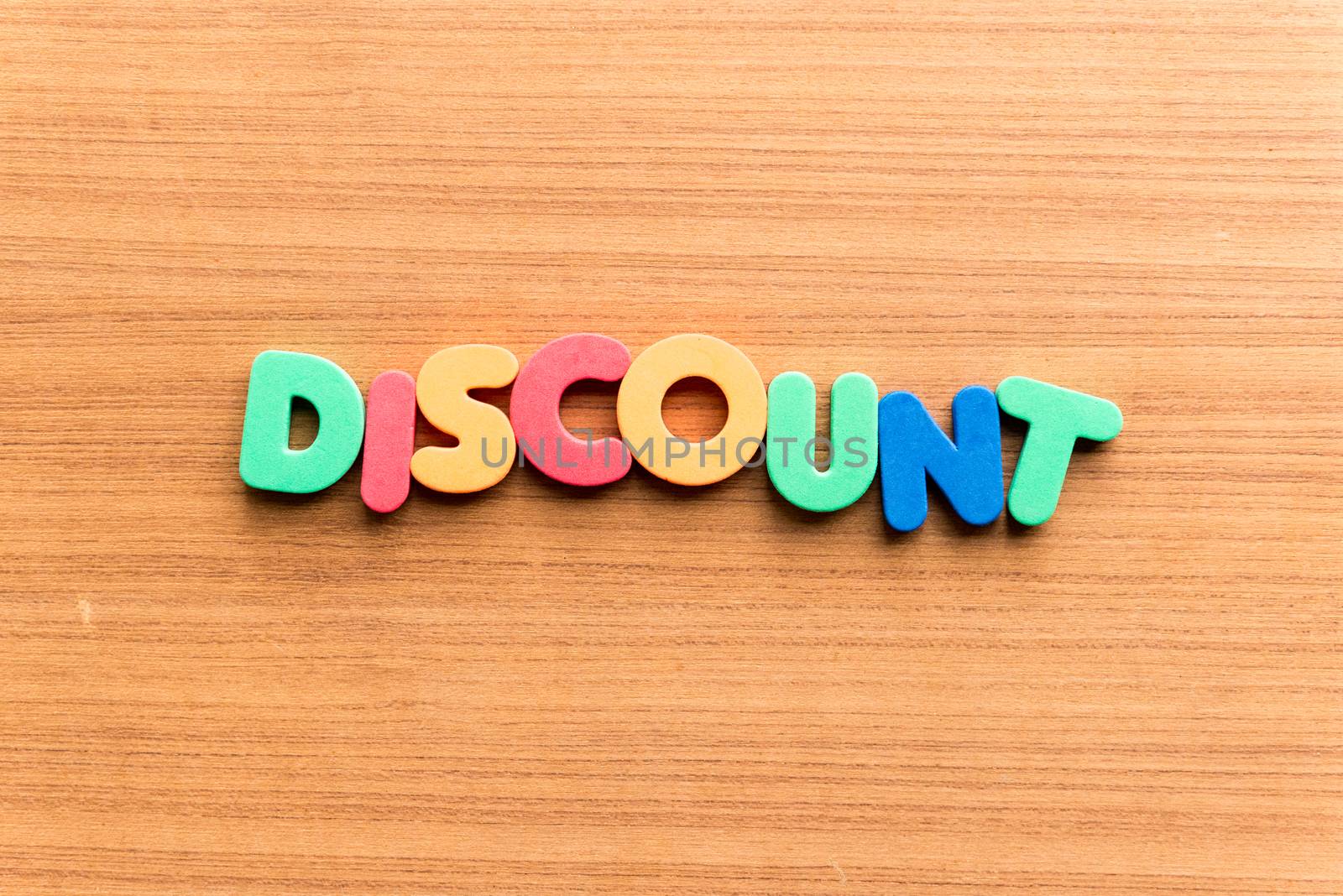 discount colorful word on the wooden background