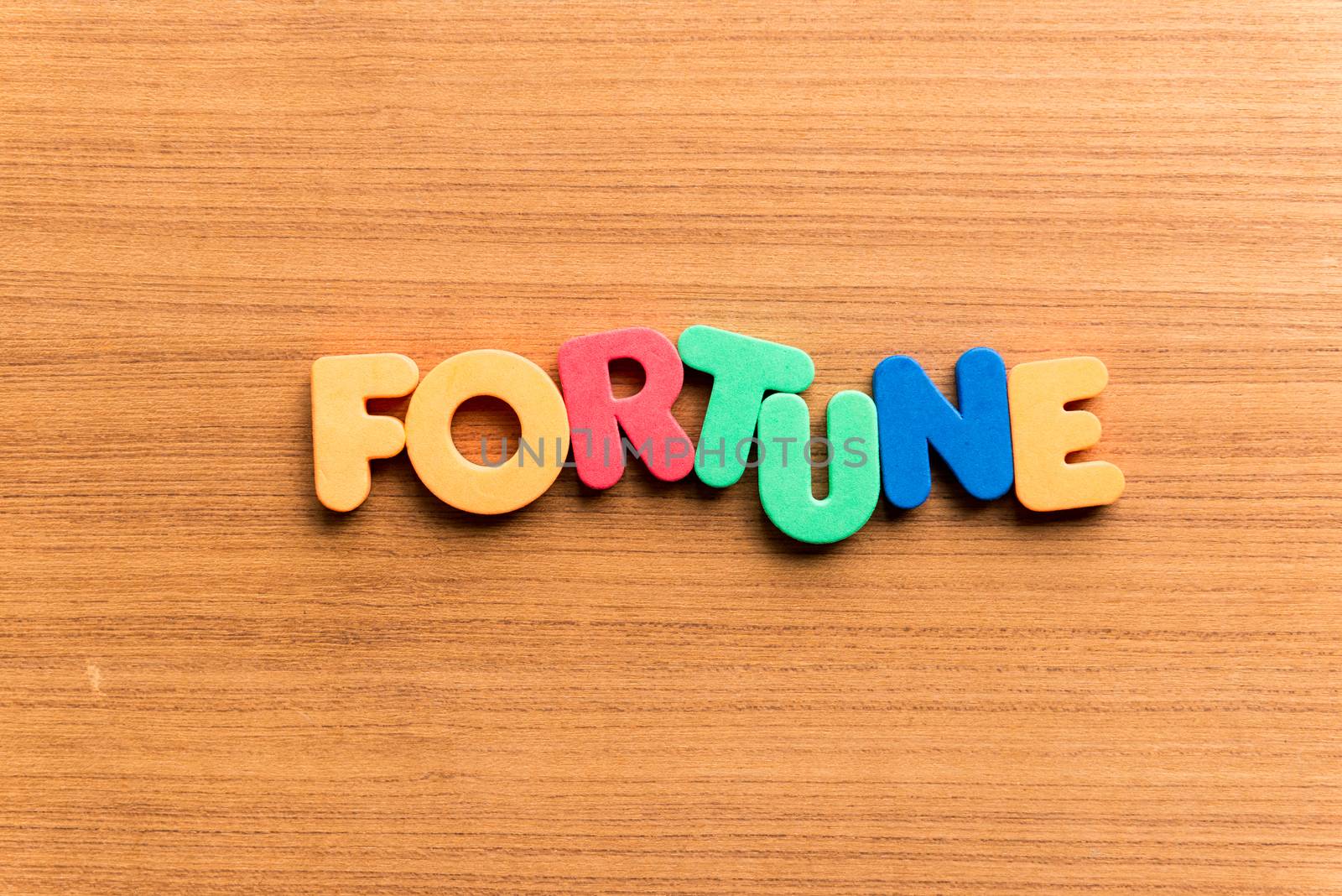 fortune colorful word on the wooden background