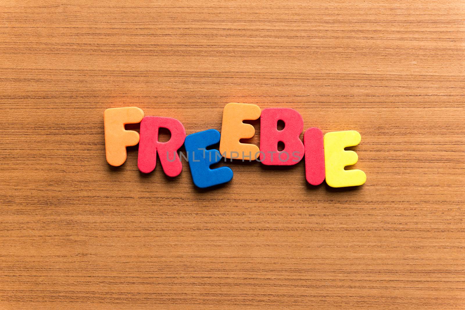 freebie colorful word on the wooden background