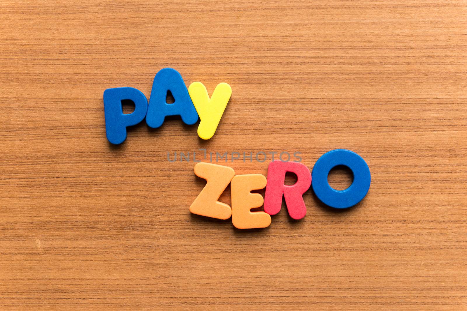 pay zero colorful word on the wooden background