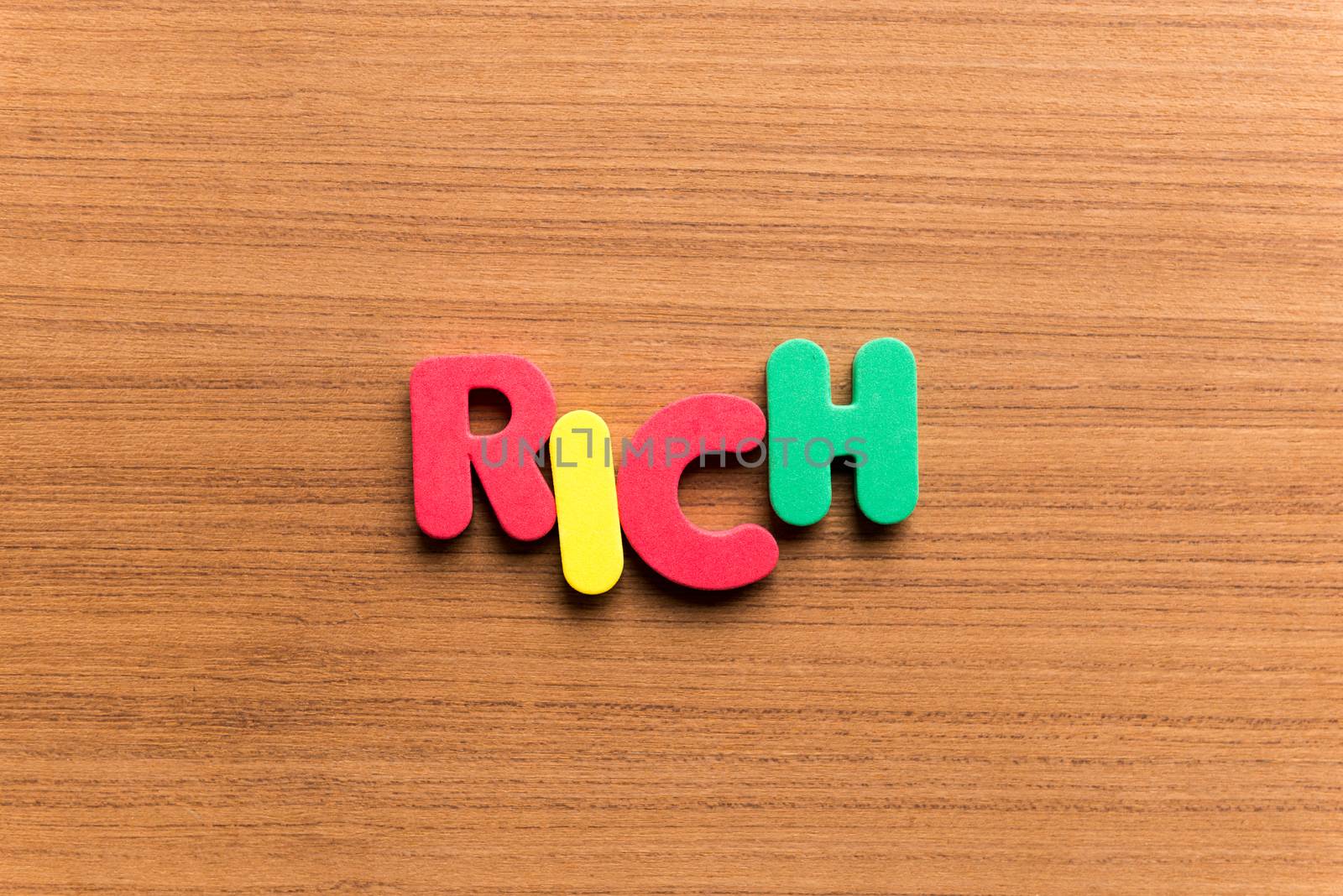 rich colorful word on the wooden background