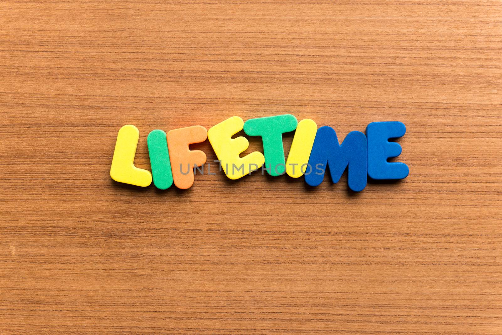lifetime colorful word on the wooden background