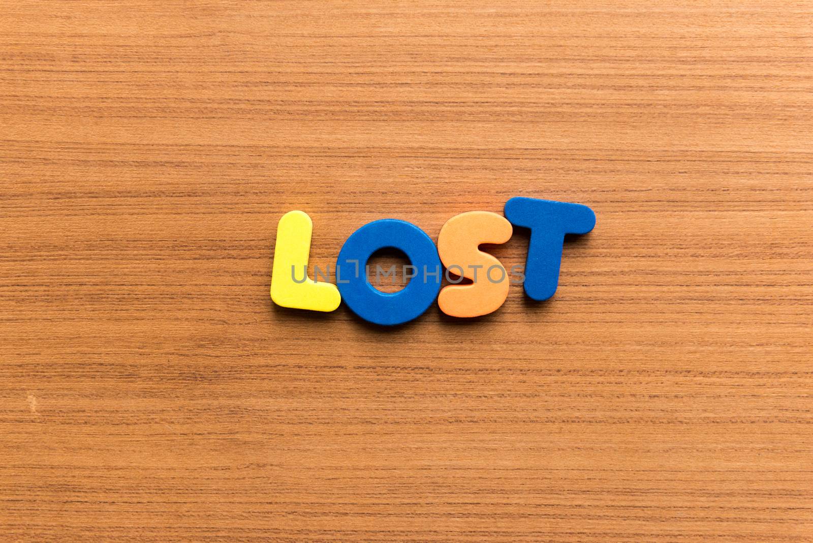 lost colorful word on the wooden background
