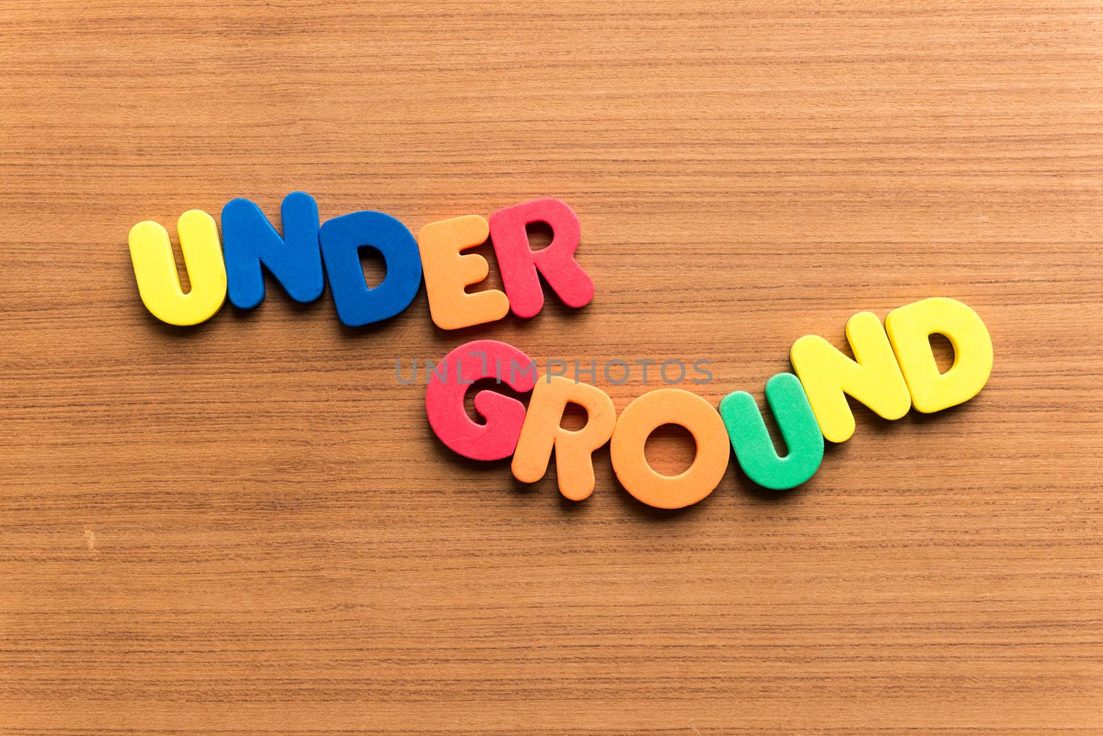 underground colorful word on the wooden background