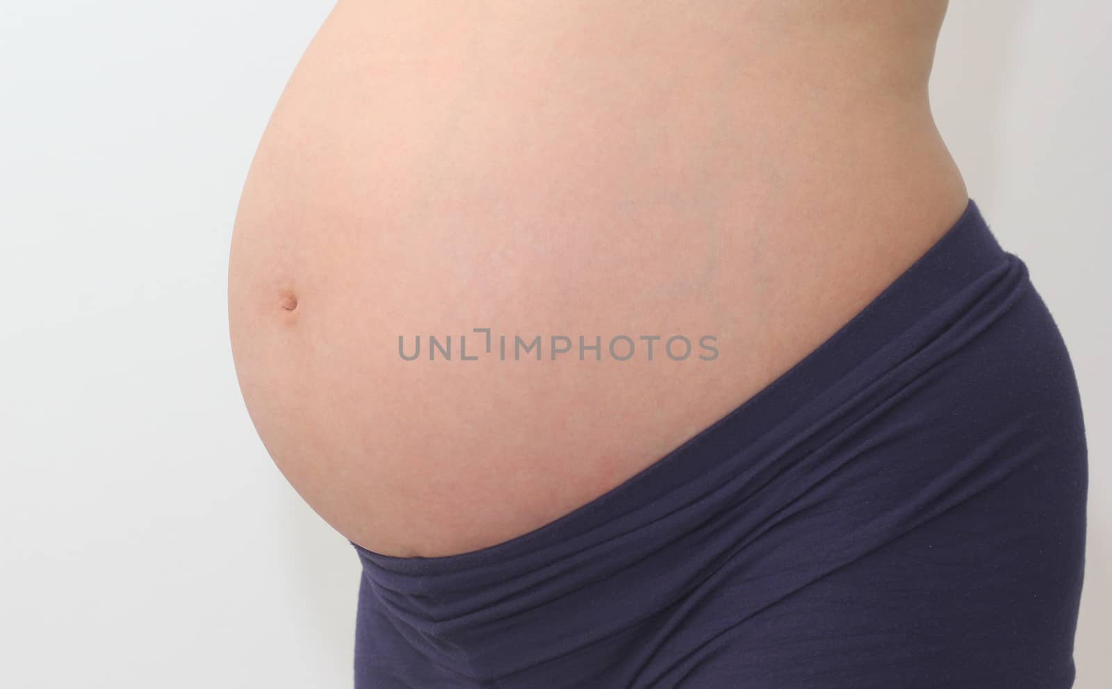 Photo of a cute pregnant woman belly