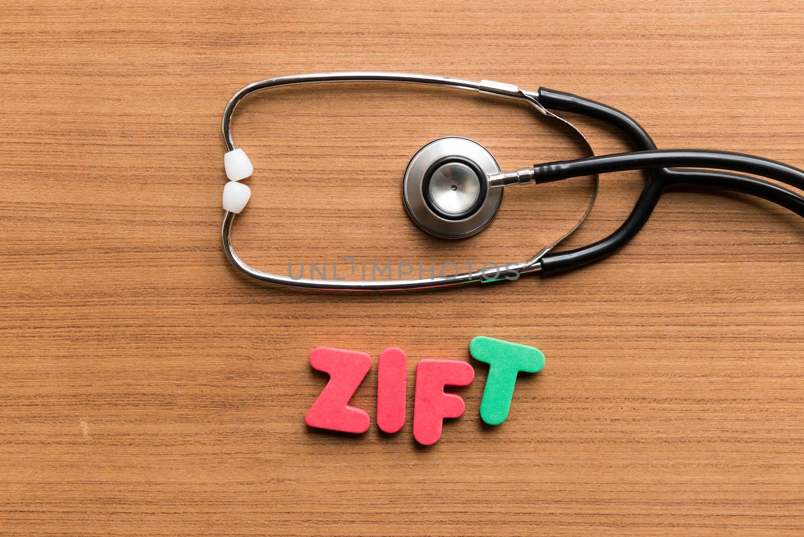 zift colorful word with stethoscope on wooden background
