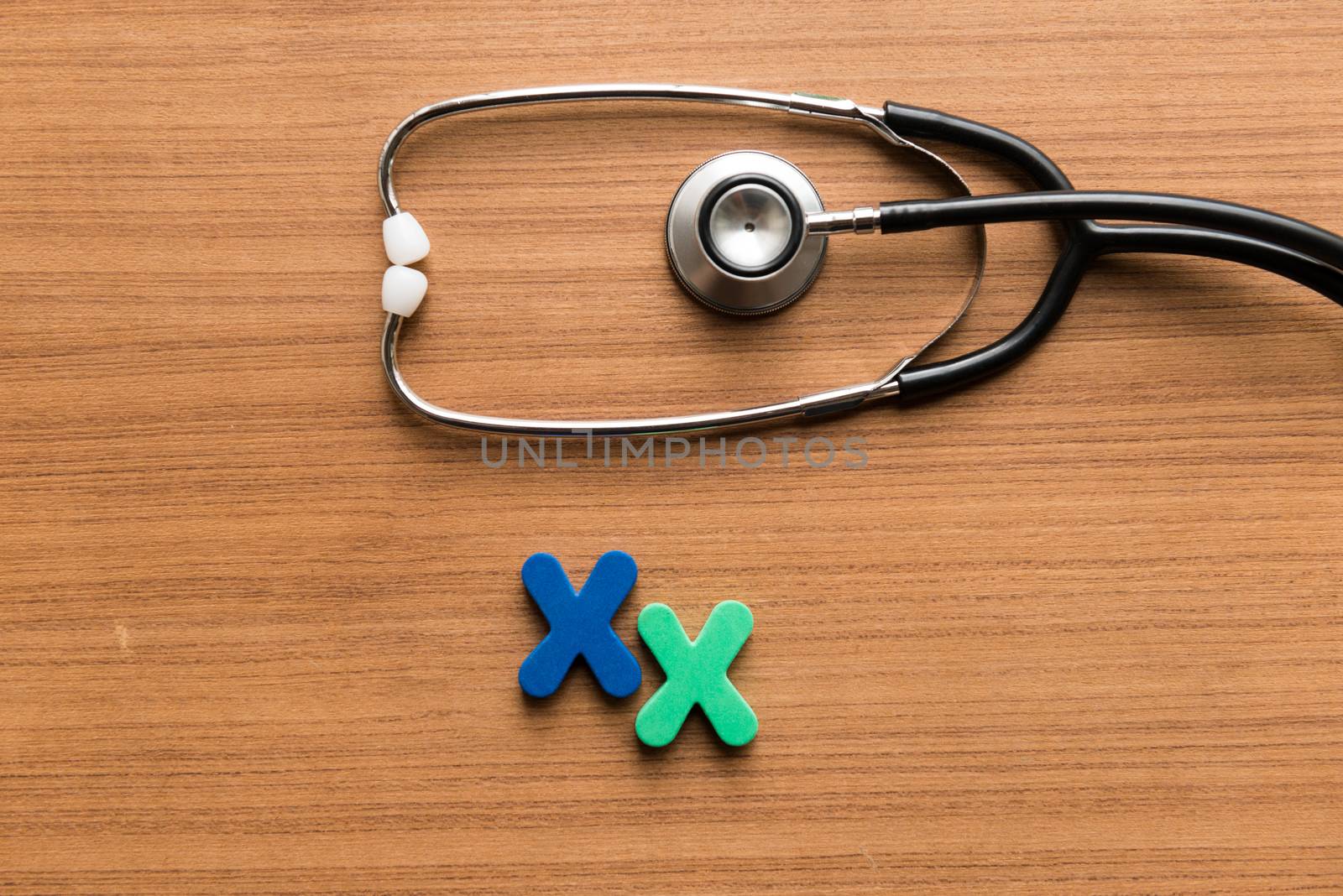 xx colorful word with stethoscope on wooden background