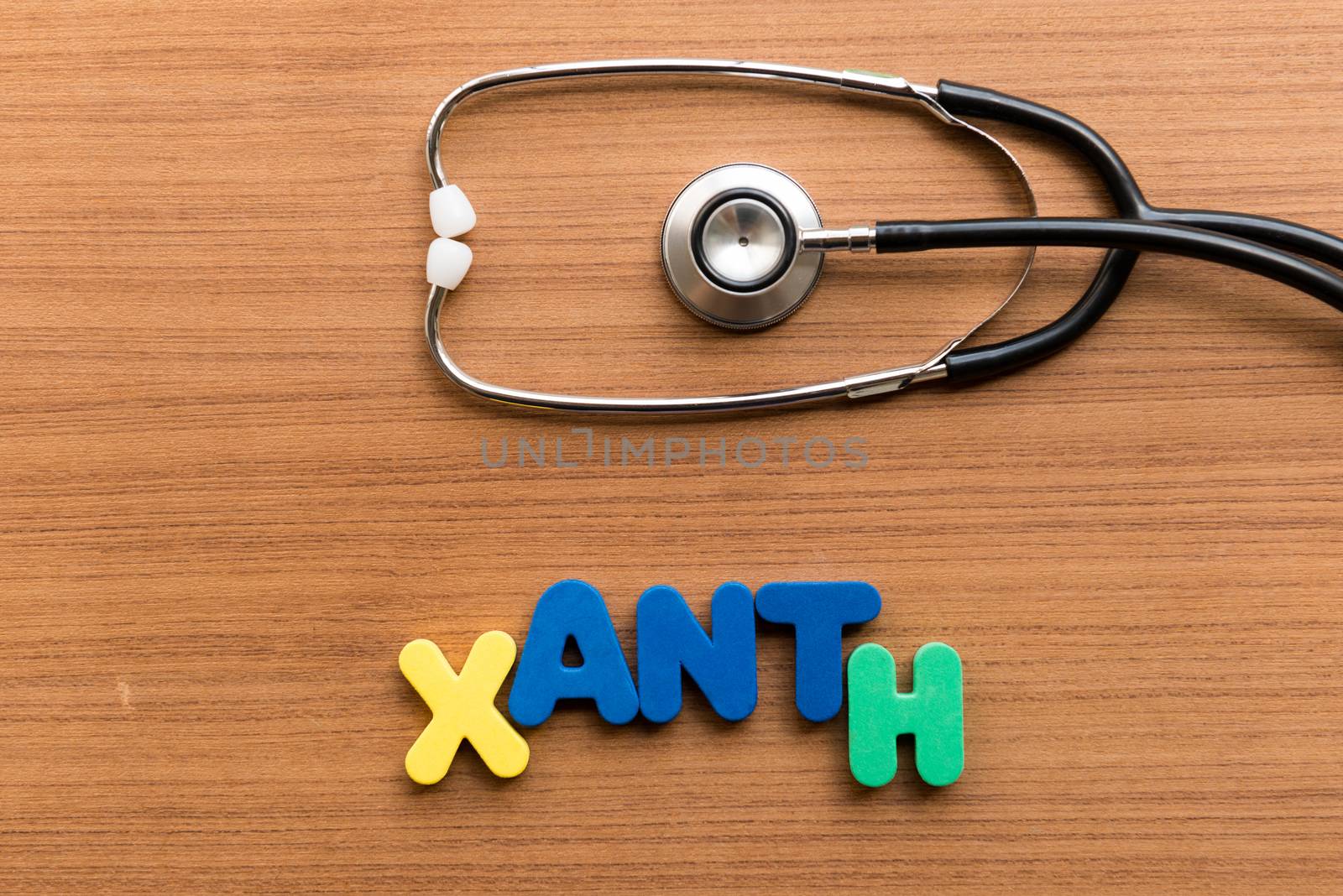 xanth colorful word with stethoscope on wooden background