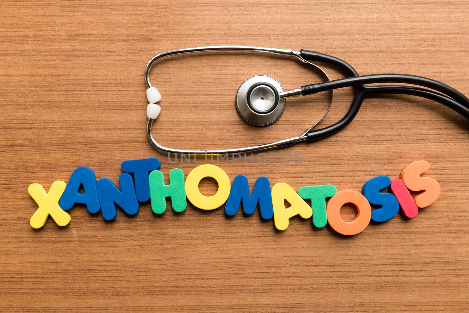 xanthomatosis colorful word with stethoscope on wooden background