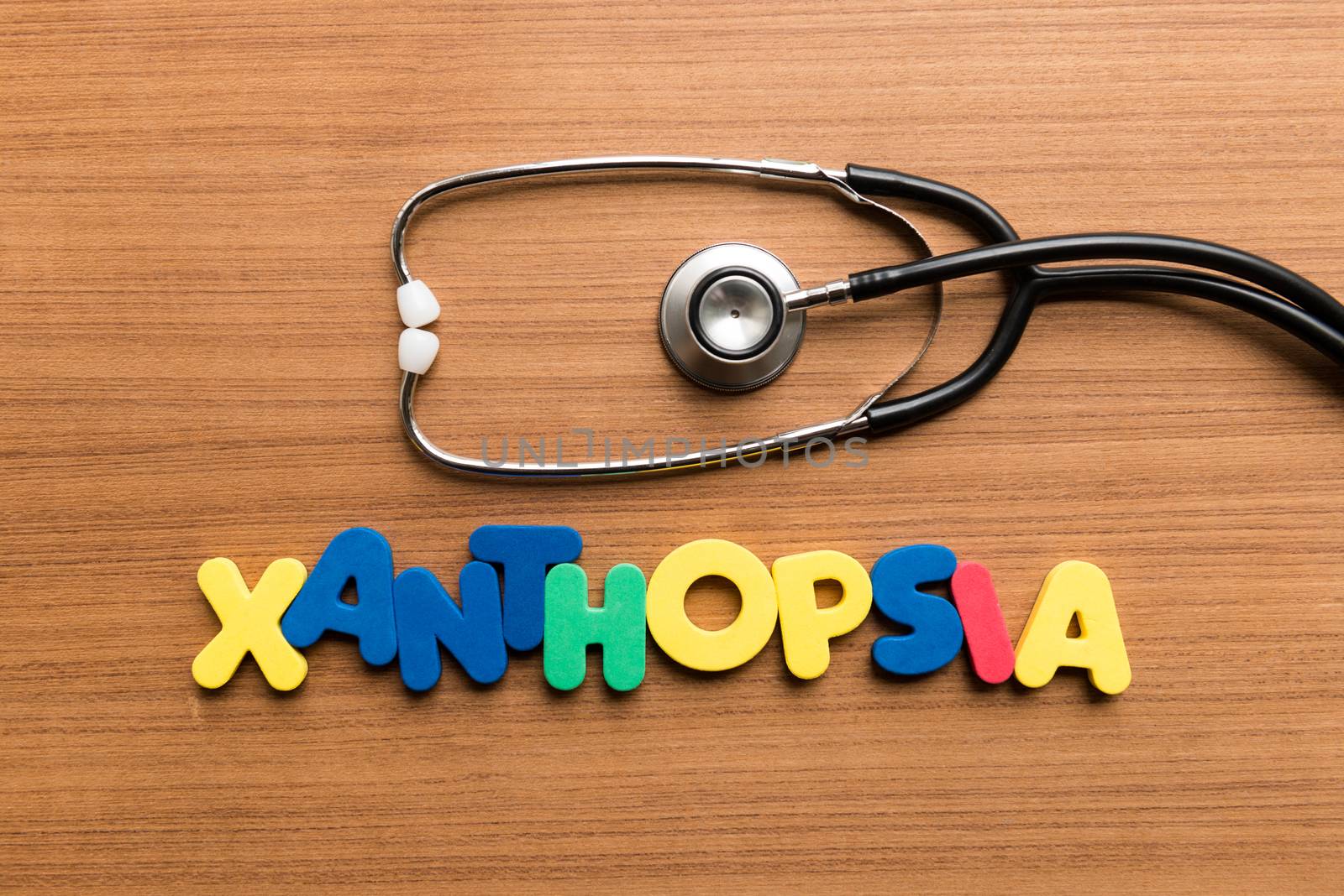 xanthopsia colorful word with stethoscope on wooden background