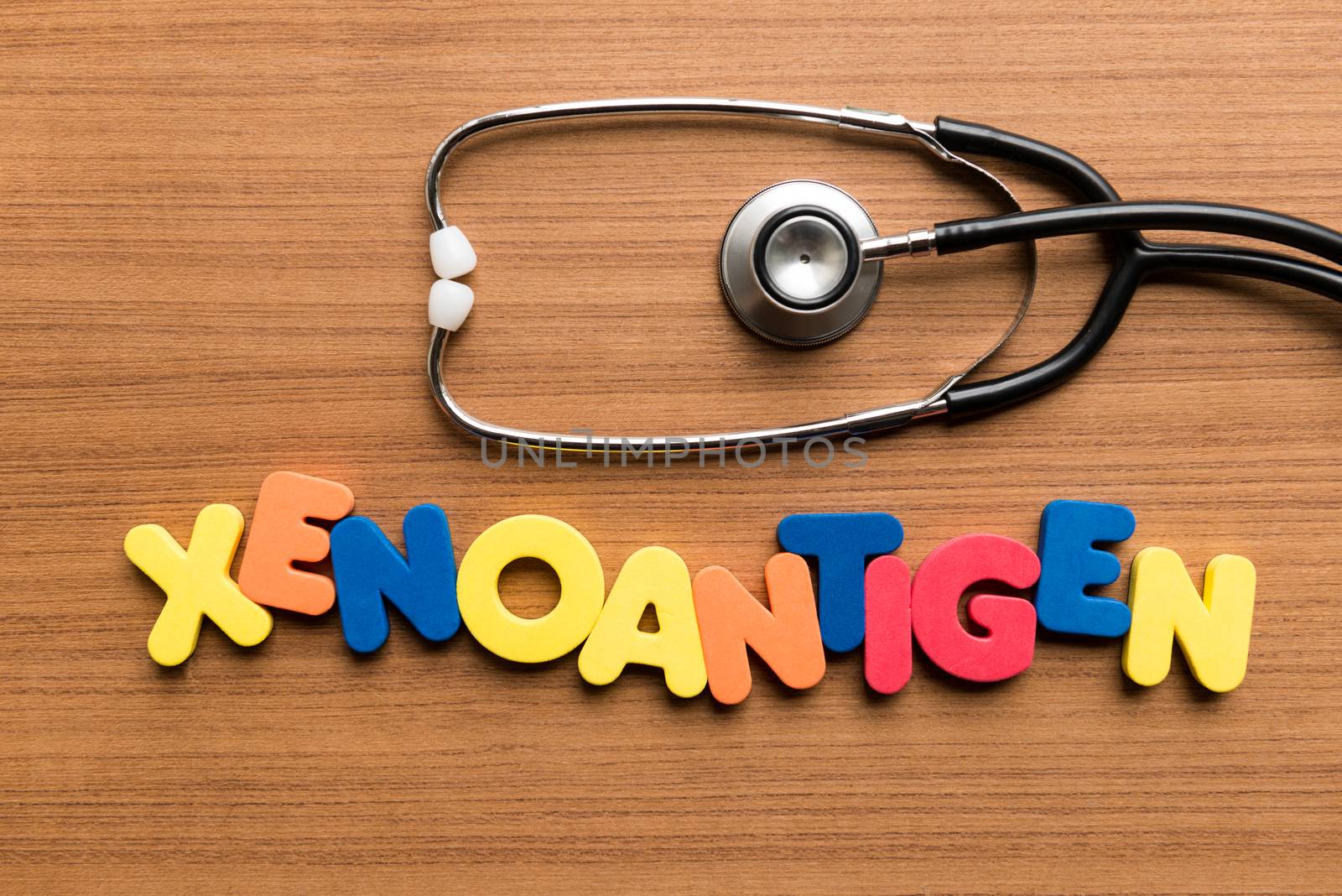 xenoantigen colorful word with stethoscope on wooden background