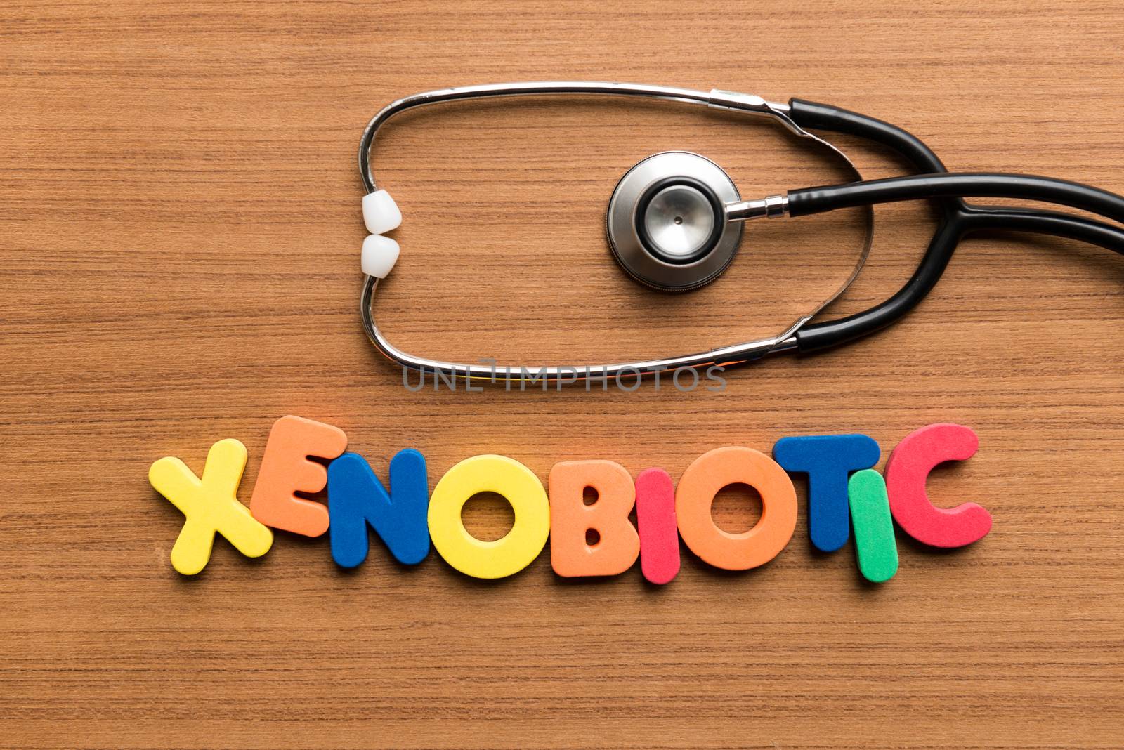 xenobiotic colorful word with stethoscope on wooden background