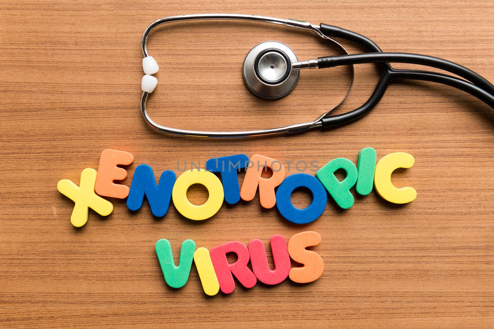 xenotropic virus colorful word with stethoscope on wooden background