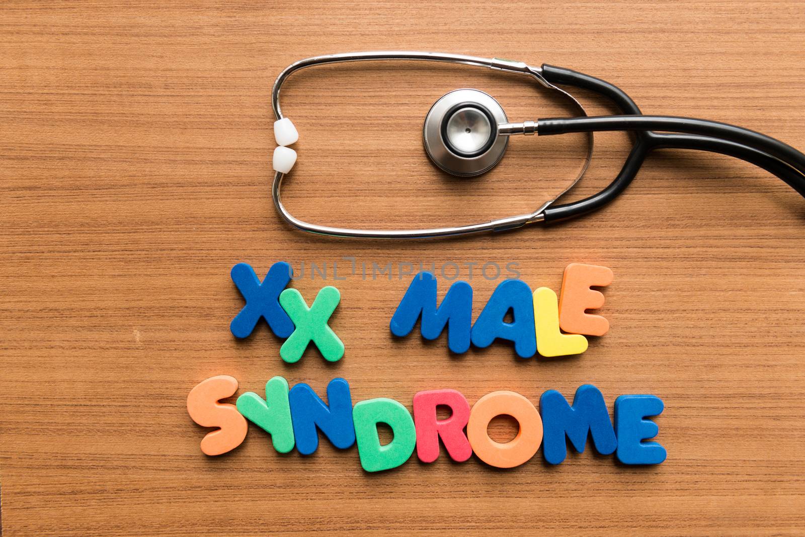 xx male syndrome colorful word with stethoscope on wooden background