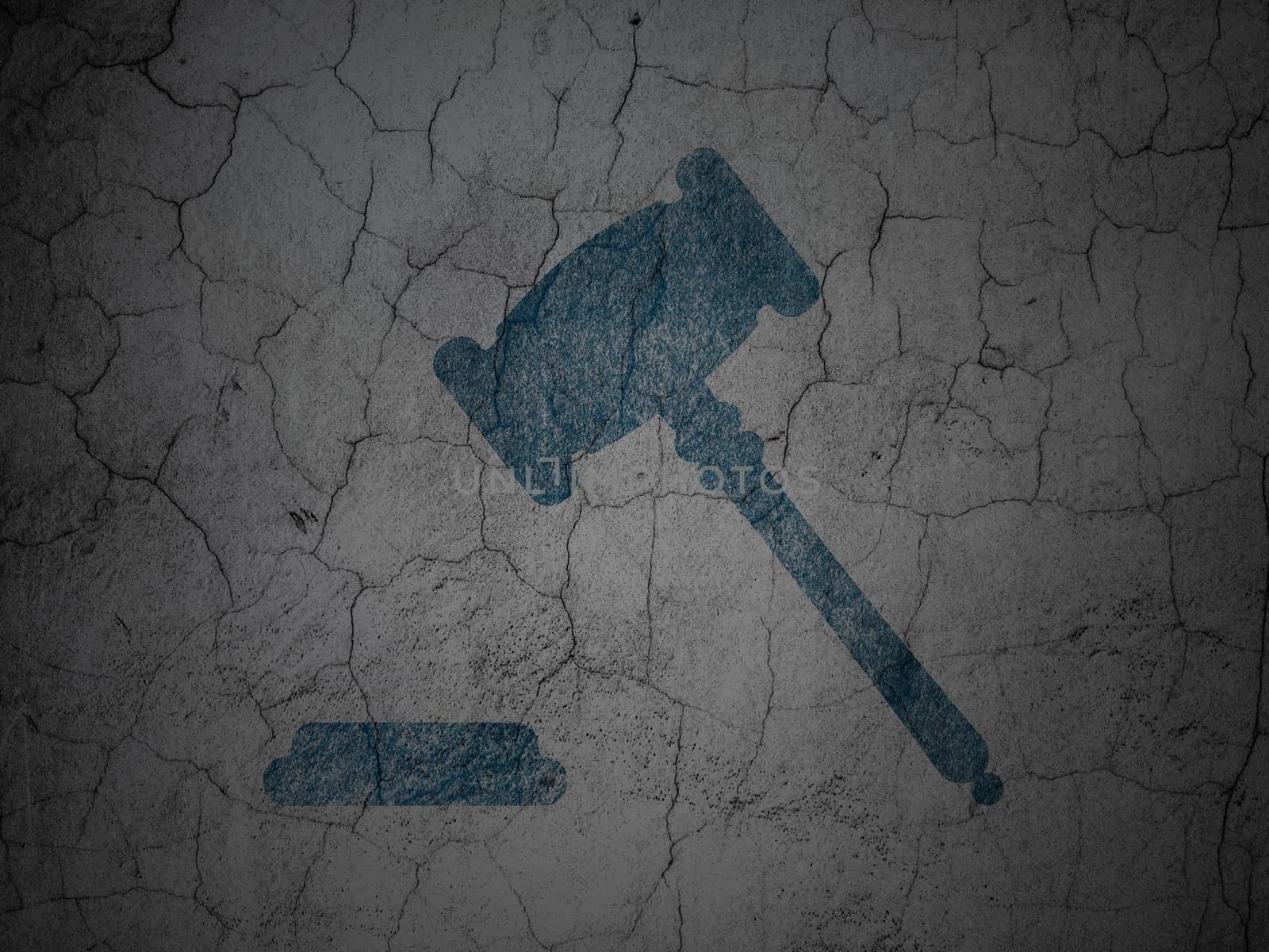 Law concept: Blue Gavel on grunge textured concrete wall background