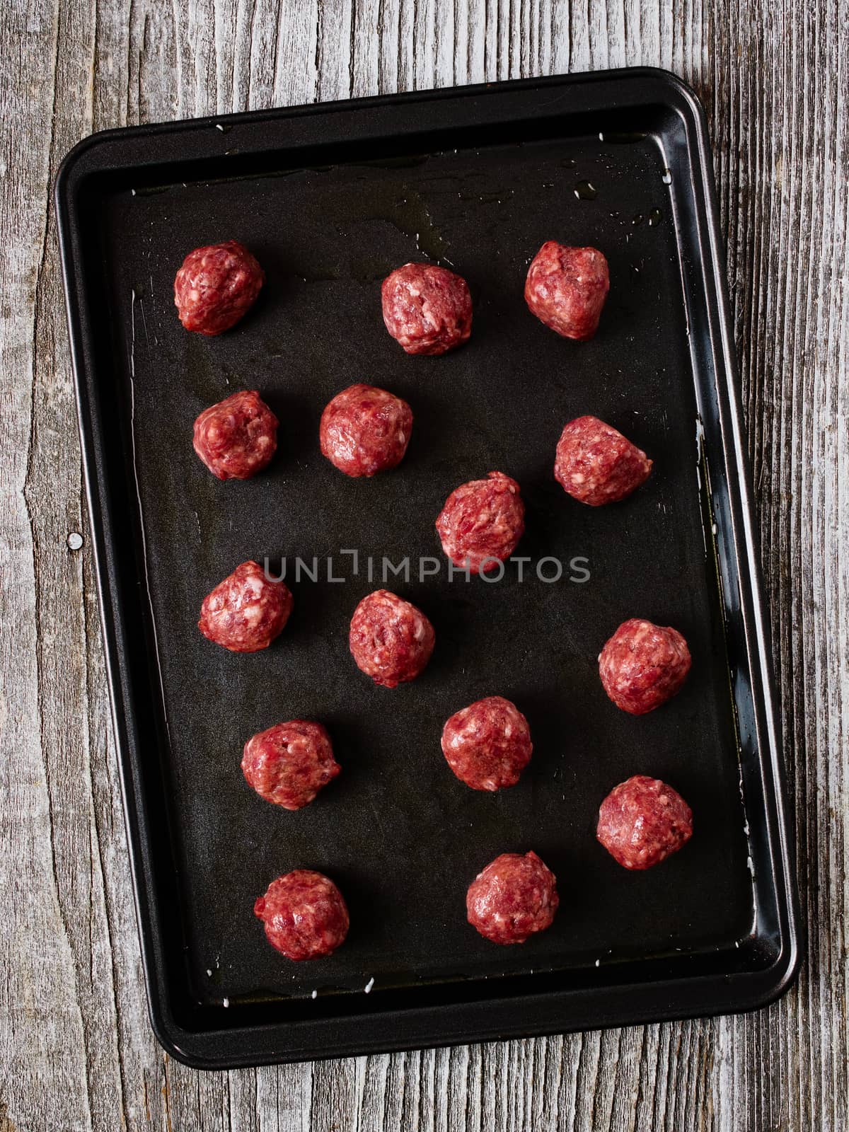 close up of tray  uncooked meatball