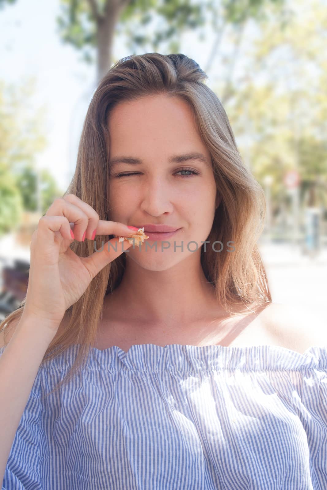 cute model woman eat croissant at outdoor