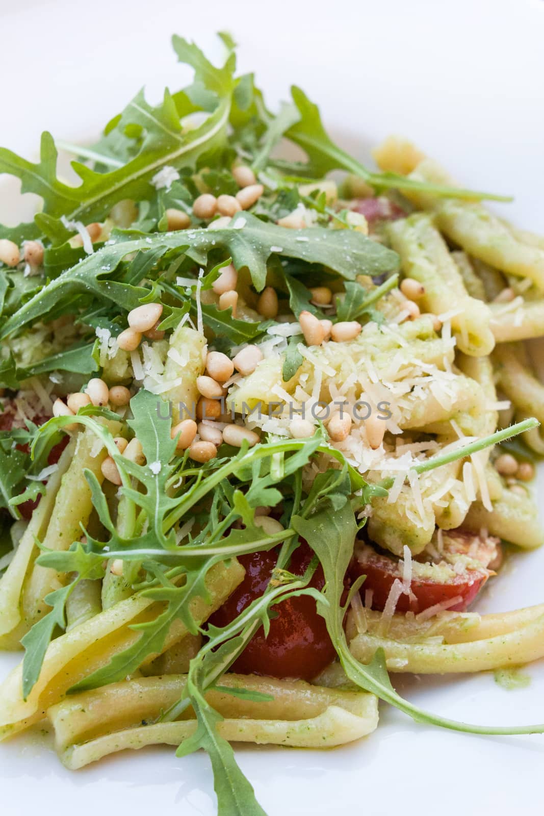 pasta with fresh arugula salad and pine nuts