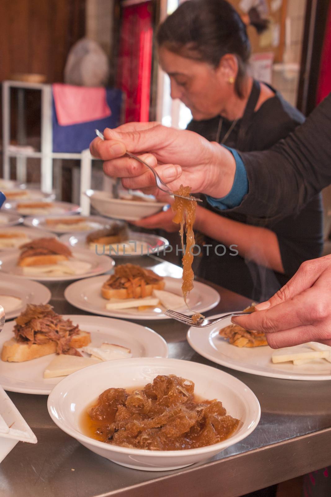 Tenerife, Spain, January 2015: Waitress prepare meals for customers on Bodega Monje- one of leading wine manufactures on north of Tenerife