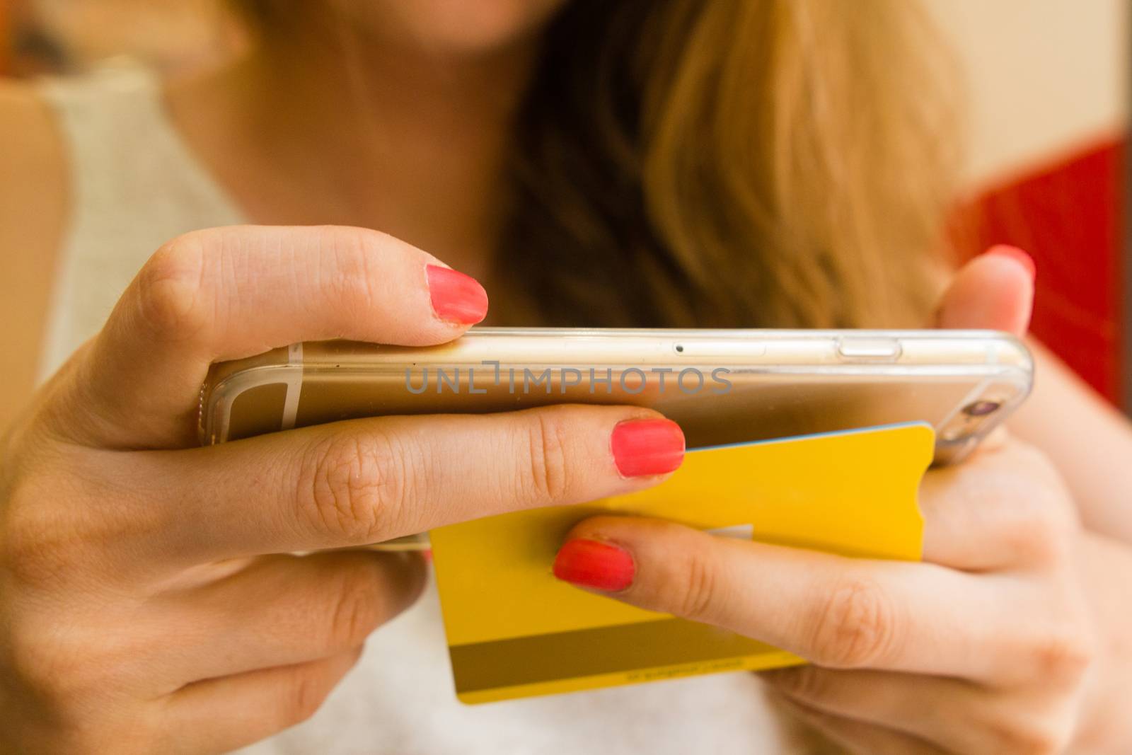 Woman holding smart phone and credit card. Shopping Online. Transfering. Online payment using smartphone and credit card