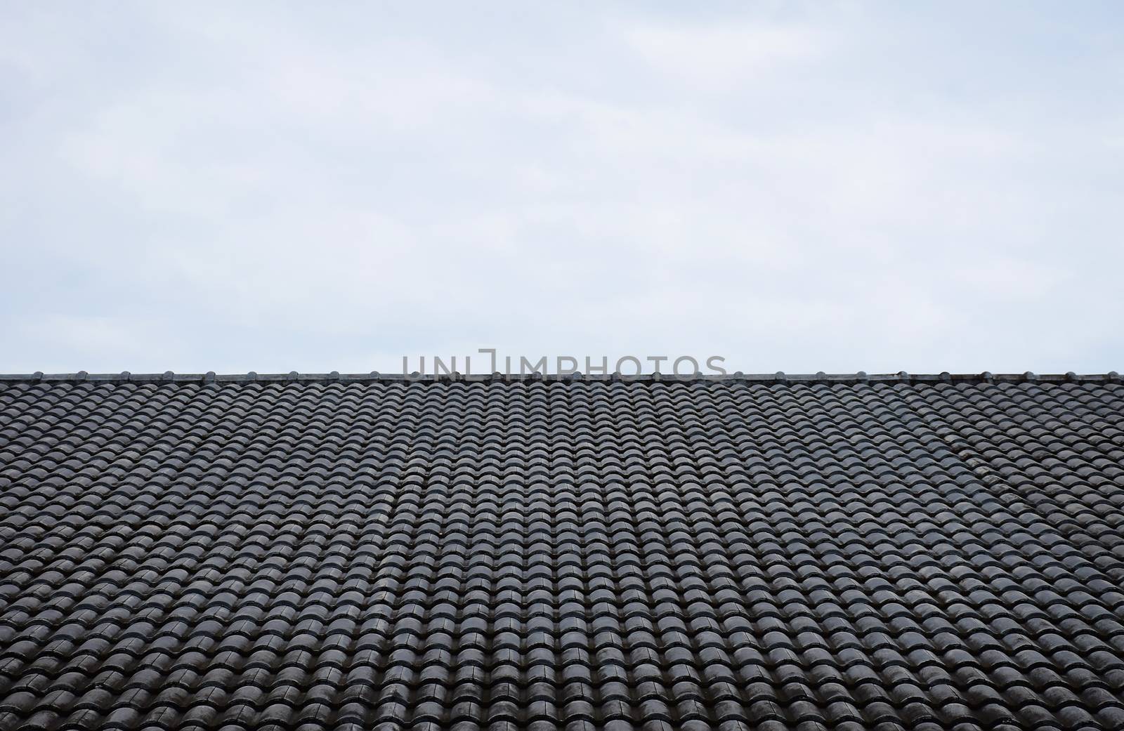 Close up roof texture with blue sky background.