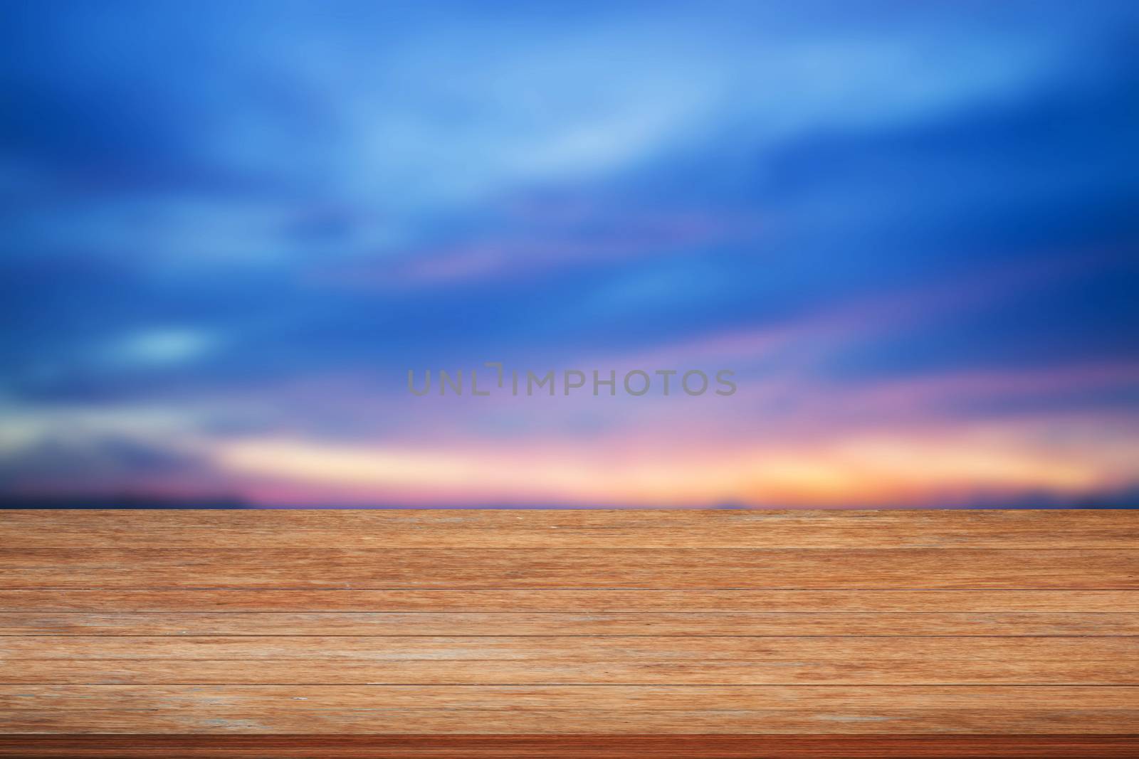 Top of wooden table on blue sunset sky background by punsayaporn