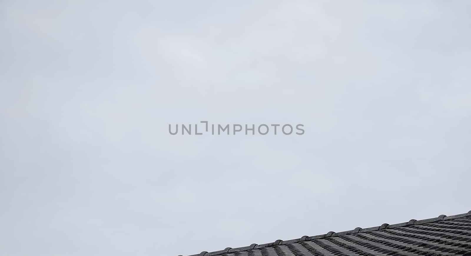 Close up roof texture with blue sky background.