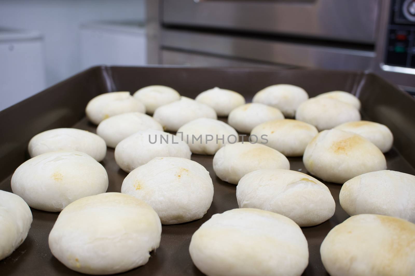 Chinese Pastry Mung Bean on brown oven tray have oven as background.