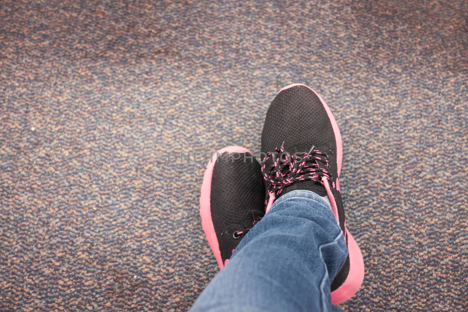 Top view of black shoe on carpet by punsayaporn