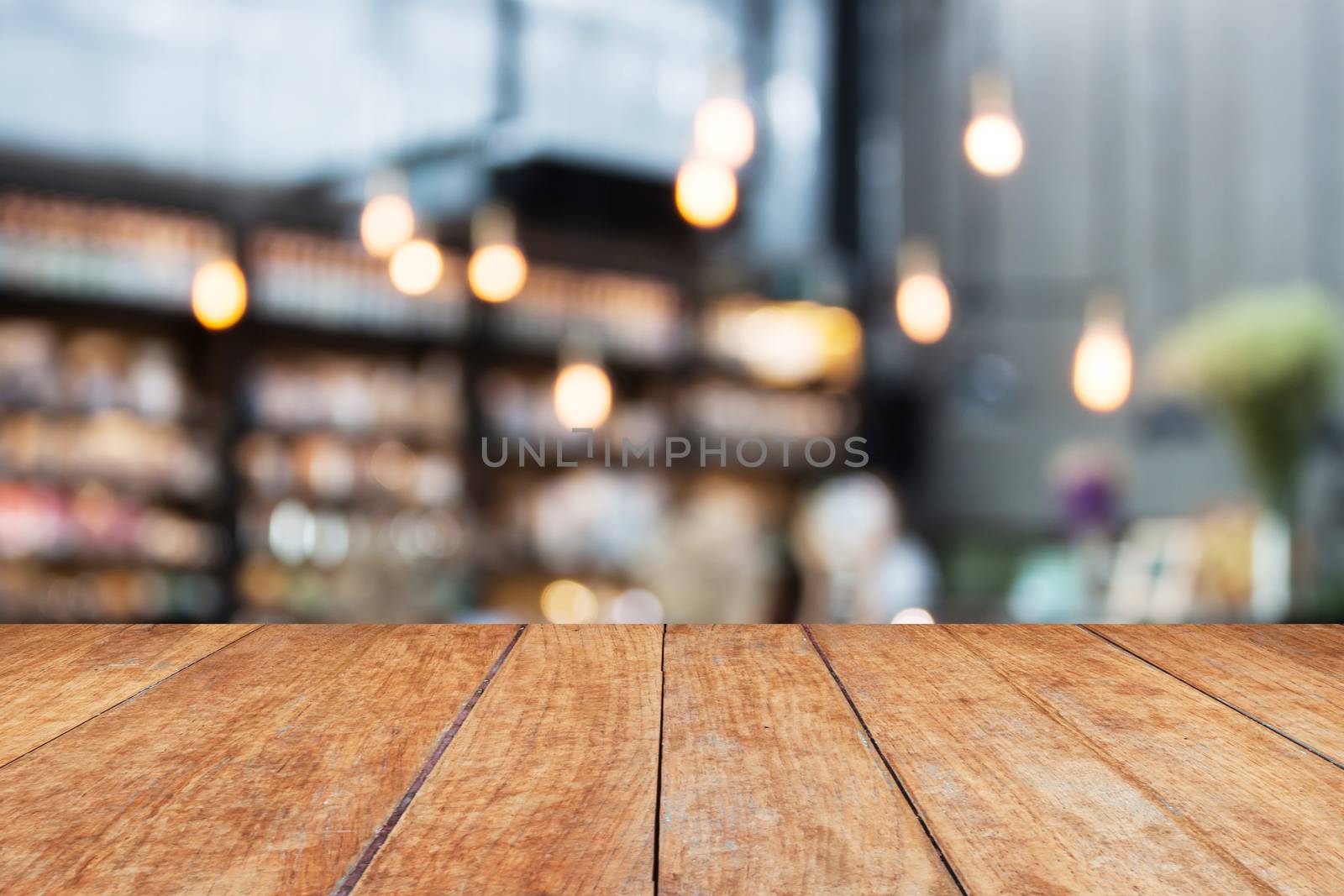 Perspective wood and blurred cafe background. product display template