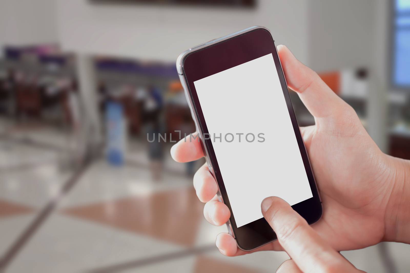 Smart phone with white screen in hand on blurred background by punsayaporn