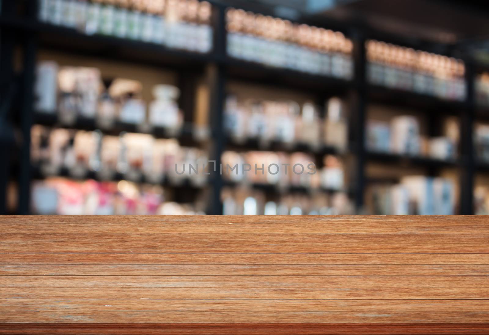 Top wooden table in coffee shop blurred background by punsayaporn