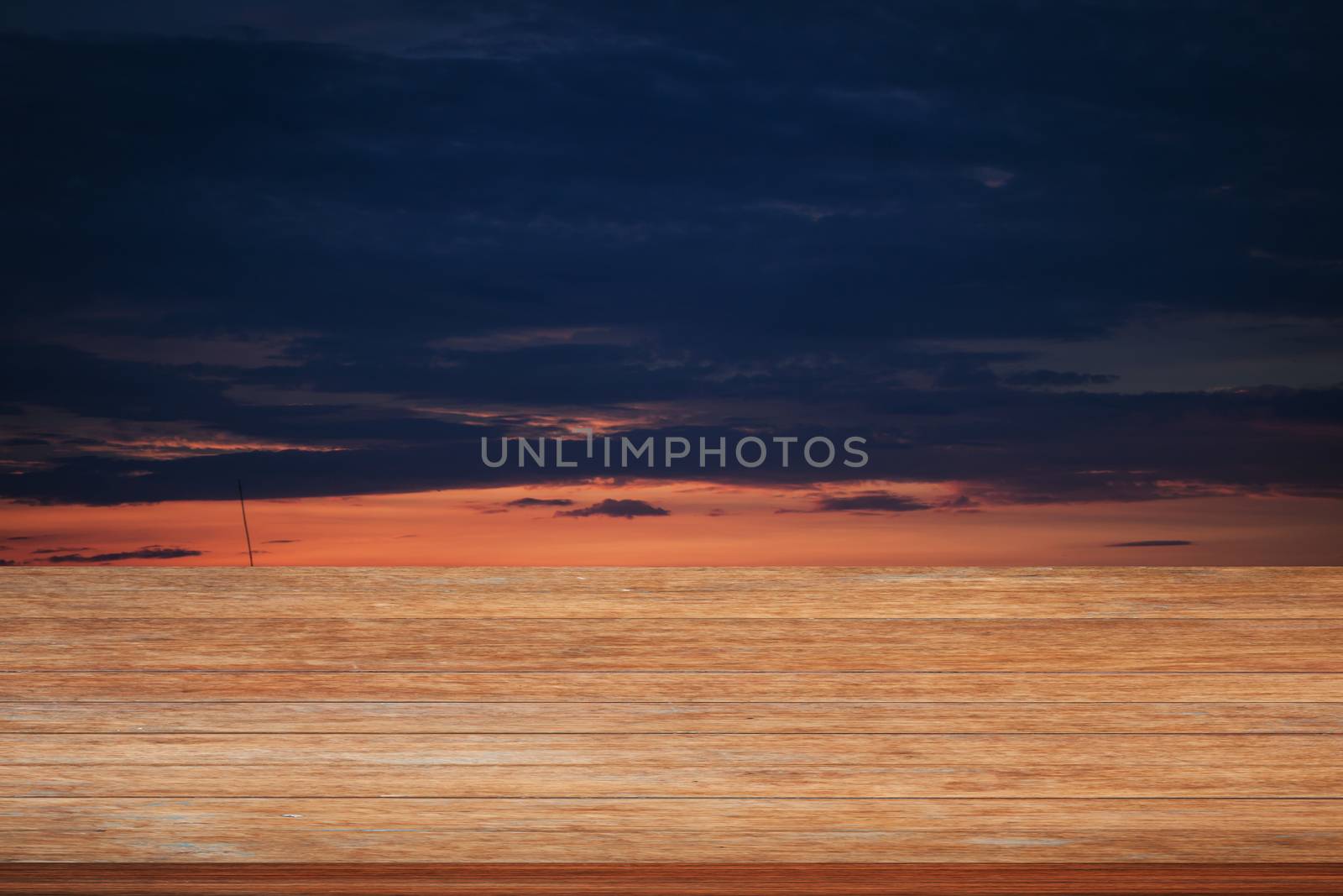 Wooden table top with sunrise on the lake with beautiful sky