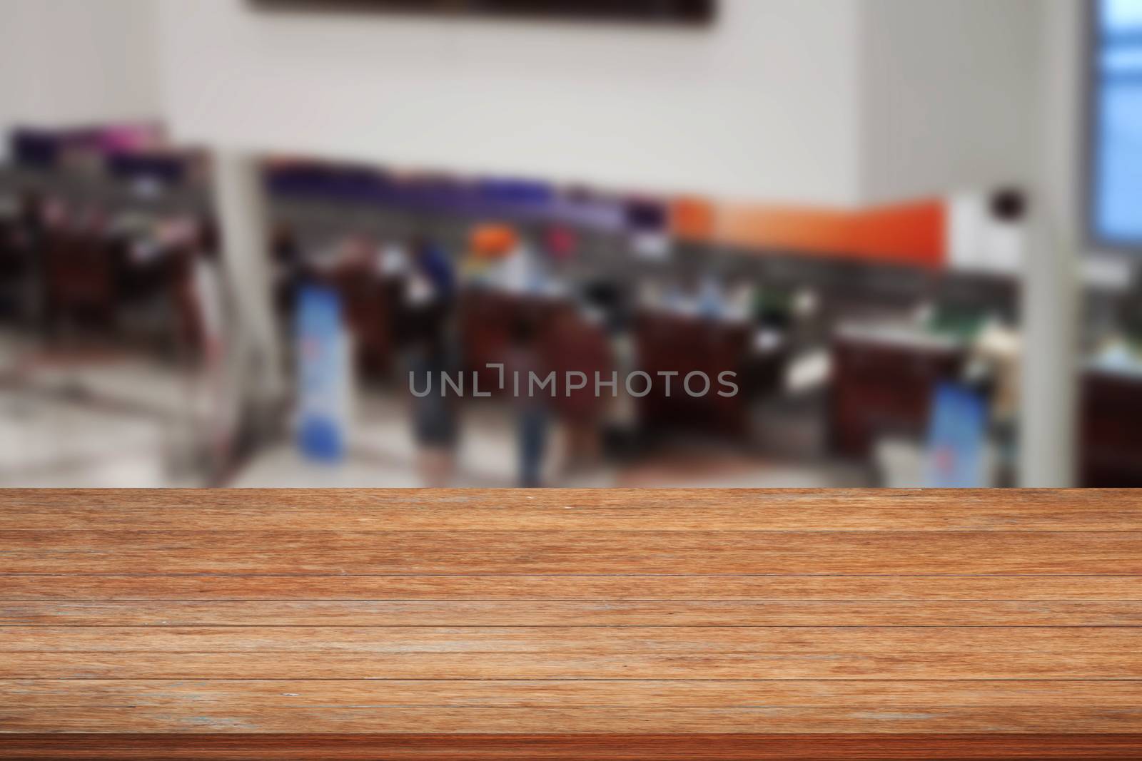 Top of wooden table on blurred background of Airport, stock photo