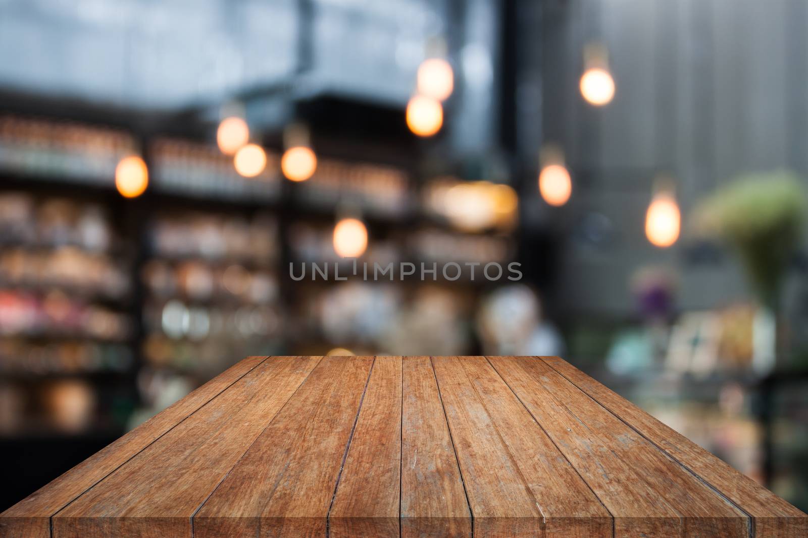 Table top wood with coffee shop blurred background by punsayaporn